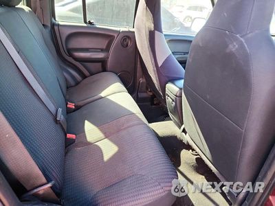 Zdjęcie 11 z 13 samochodu: 2003 JEEP LIBERTY SPORT VIN:1J4GL48K03W607336 - miniatura
