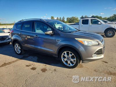 Czwarte zdjęcie samochodu z boku: 2014 FORD ESCAPE TITANIUM VIN:1FMCU9J98EUC72620 - miniatura