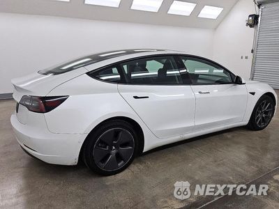 Trzecie zdjęcie samochodu z tyłu: 2022 TESLA MODEL 3 VIN:5YJ3E1EA7NF288078 - miniatura