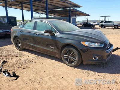 Czwarte zdjęcie samochodu z boku: 2016 FORD FUSION TITANIUM PHEV VIN:3FA6P0SU1GR141911 - miniatura