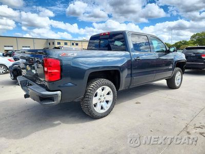 Trzecie zdjęcie samochodu z tyłu: 2017 CHEVROLET SILVERADO K1500 LT VIN:3GCUKREC8HG456323 - miniatura
