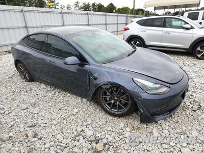 Czwarte zdjęcie samochodu z boku: 2022 TESLA MODEL 3 VIN:5YJ3E1EB4NF119161 - miniatura