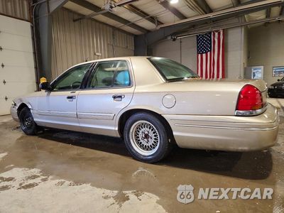 Drugie zdjęcie samochodu z przodu: 1999 FORD CROWN VICTORIA LX VIN:2FAFP74W4XX236665 - miniatura
