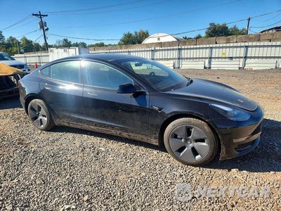 Czwarte zdjęcie samochodu z boku: 2023 TESLA MODEL 3 VIN:5YJ3E1EA6PF669133 - miniatura