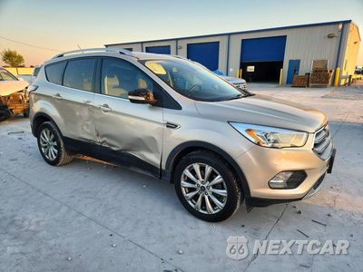 Czwarte zdjęcie samochodu z boku: 2017 FORD ESCAPE TITANIUM VIN:1FMCU0JD3HUE46856 - miniatura