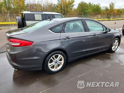 Trzecie zdjęcie samochodu z tyłu: 2018 FORD FUSION SE VIN:3FA6P0HD2JR266916 - miniatura