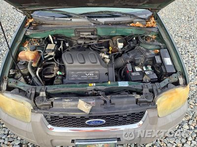 Zdjęcie 12 z 13 samochodu: 2001 FORD ESCAPE XLT VIN:1FMYU04191KB93311 - miniatura