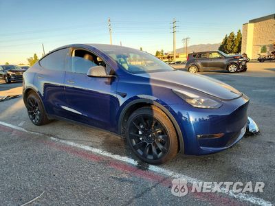 Czwarte zdjęcie samochodu z boku: 2023 TESLA MODEL Y VIN:7SAYGDEE8PF937655 - miniatura