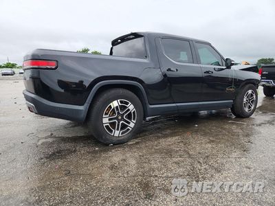 Trzecie zdjęcie samochodu z tyłu: 2023 RIVIAN R1T ADVENTURE VIN:7FCTGAAA0PN018978 - miniatura