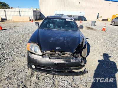Piąte zdjęcie samochodu w środku: 2004 HYUNDAI TIBURON GT VIN:KMHHN65FX4U118474 - miniatura