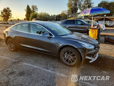 Czwarte zdjęcie samochodu z boku: 2020 TESLA MODEL 3 VIN:5YJ3E1EBXLF649583 - miniatura