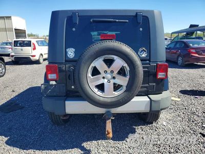 Zdjęcie 6 z 12 samochodu: 2009 JEEP WRANGLER UNLIMITED SAHARA VIN:1J4GA591X9L732081 - miniatura