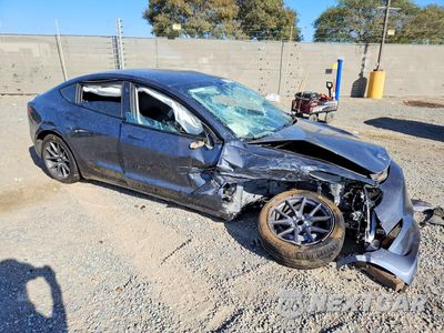Czwarte zdjęcie samochodu z boku: 2023 TESLA MODEL 3 VIN:5YJ3E1EA0PF712073 - miniatura