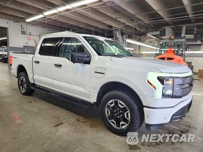 Czwarte zdjęcie samochodu z boku: 2022 FORD F150 LIGHTNING PRO VIN:1FTVW1EL9NWG12795 - miniatura