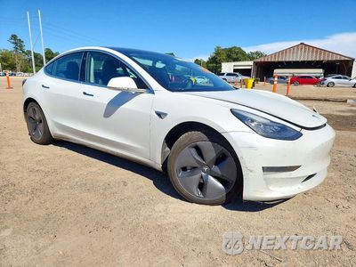 Czwarte zdjęcie samochodu z boku: 2019 TESLA MODEL 3 VIN:5YJ3E1EB2KF469173 - miniatura