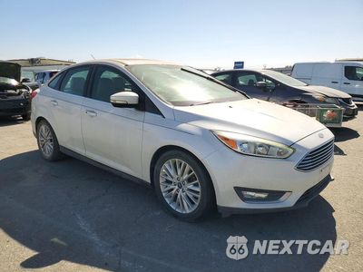 Czwarte zdjęcie samochodu z boku: 2017 FORD FOCUS TITANIUM VIN:1FADP3J22HL260740 - miniatura