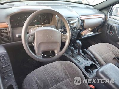 Zdjęcie 8 z 13 samochodu: 1999 JEEP GRAND CHEROKEE LAREDO VIN:1J4GW58S3XC609781 - miniatura