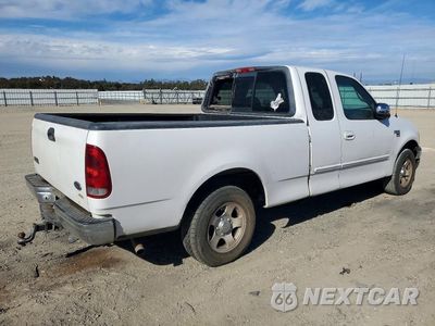 Trzecie zdjęcie samochodu z tyłu: 2000 FORD F150 VIN:1FTRX17L1YKA73385 - miniatura