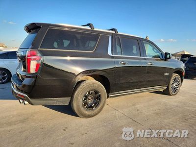 Trzecie zdjęcie samochodu z tyłu: 2021 CHEVROLET SUBURBAN K1500 PREMIER VIN:1GNSKFKD6MR217020 - miniatura