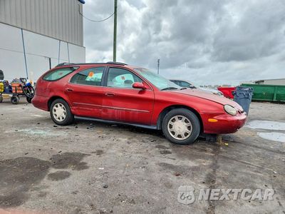 Czwarte zdjęcie samochodu z boku: 1996 FORD TAURUS VIN:1FALP57U1TA145664 - miniatura