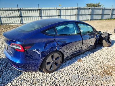 Trzecie zdjęcie samochodu z tyłu: 2022 TESLA MODEL 3 VIN:5YJ3E1EB7NF194503 - miniatura