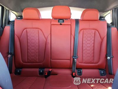 Zdjęcie 10 z 14 samochodu: 2023 BMW X4 M VIN:5YM23EC00P9S11365 - miniatura