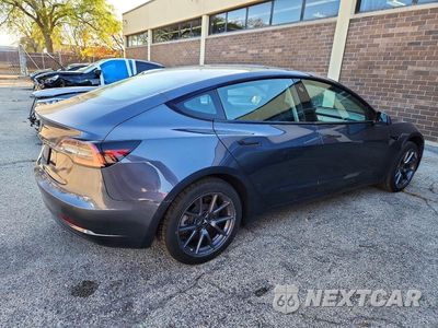 Trzecie zdjęcie samochodu z tyłu: 2022 TESLA MODEL 3 VIN:5YJ3E1EA2NF287971 - miniatura