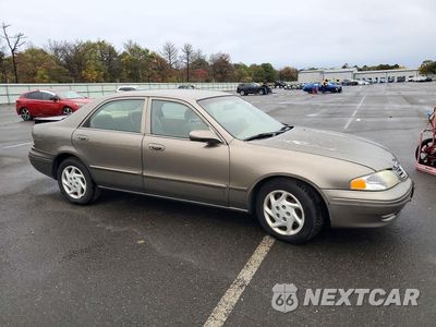 Czwarte zdjęcie samochodu z boku: 2002 MAZDA 626 LX VIN:1YVGF22C025298789 - miniatura