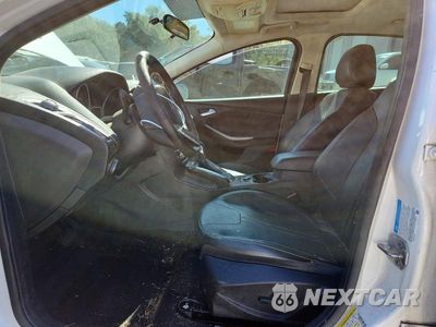 Zdjęcie 7 z 13 samochodu: 2013 FORD FOCUS TITANIUM VIN:1FADP3J21DL116879 - miniatura