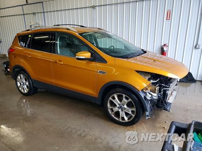 Czwarte zdjęcie samochodu z boku: 2016 FORD ESCAPE TITANIUM VIN:1FMCU9J99GUB80757 - miniatura