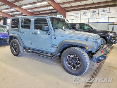 Czwarte zdjęcie samochodu z boku: 2015 JEEP WRANGLER UNLIMITED SPORT VIN:1C4BJWDG0FL529584 - miniatura