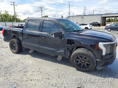Czwarte zdjęcie samochodu z boku: 2022 FORD F150 LIGHTNING PRO VIN:1FT6W1EV2NWG03300 - miniatura