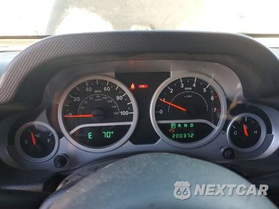 Zdjęcie 9 z 12 samochodu: 2009 JEEP WRANGLER UNLIMITED SAHARA VIN:1J4GA591X9L732081 - miniatura