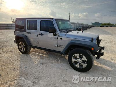 Czwarte zdjęcie samochodu z boku: 2016 JEEP WRANGLER UNLIMITED SPORT VIN:1C4BJWDG8GL125045 - miniatura