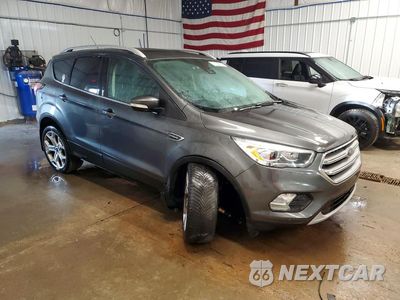 Czwarte zdjęcie samochodu z boku: 2017 FORD ESCAPE TITANIUM VIN:1FMCU9J93HUA78713 - miniatura