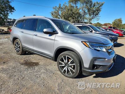 Czwarte zdjęcie samochodu z boku: 2019 HONDA PILOT TOURING VIN:5FNYF6H65KB001954 - miniatura