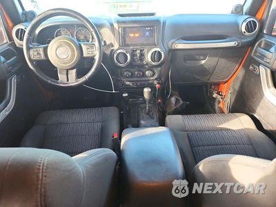 Zdjęcie 8 z 13 samochodu: 2011 JEEP WRANGLER UNLIMITED SAHARA VIN:1J4BA5H13BL604184 - miniatura