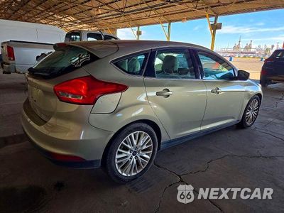 Trzecie zdjęcie samochodu z tyłu: 2016 FORD FOCUS TITANIUM VIN:1FADP3N26GL307826 - miniatura