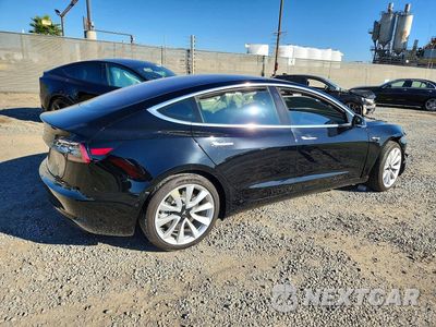 Trzecie zdjęcie samochodu z tyłu: 2018 TESLA MODEL 3 VIN:5YJ3E1EA3JF179448 - miniatura