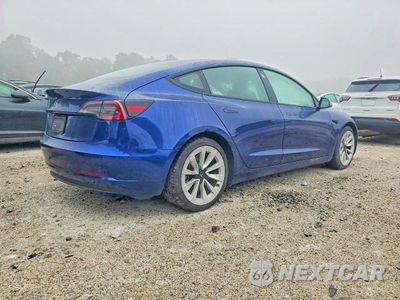 Trzecie zdjęcie samochodu z tyłu: 2022 TESLA MODEL 3 VIN:5YJ3E1EA0NF371934 - miniatura