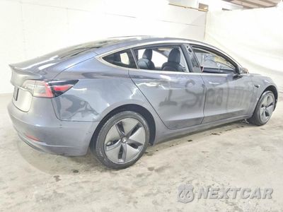 Trzecie zdjęcie samochodu z tyłu: 2019 TESLA MODEL 3 VIN:5YJ3E1EA4KF317175 - miniatura