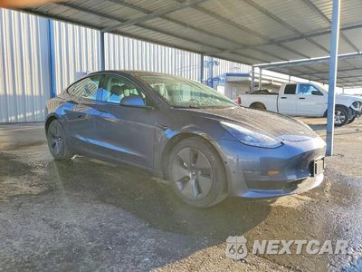 Czwarte zdjęcie samochodu z boku: 2022 TESLA MODEL 3 VIN:5YJ3E1EA0NF371254 - miniatura
