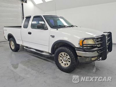 Czwarte zdjęcie samochodu z boku: 2003 FORD F150 VIN:1FTRX18L33NB21913 - miniatura