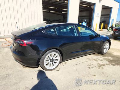 Trzecie zdjęcie samochodu z tyłu: 2022 TESLA MODEL 3 VIN:5YJ3E1EA1NF291302 - miniatura