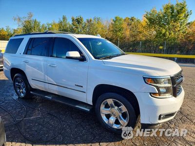 Czwarte zdjęcie samochodu z boku: 2019 CHEVROLET TAHOE K1500 LT VIN:1GNSKBKC5KR101014 - miniatura