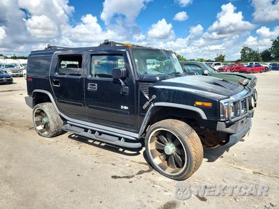 Czwarte zdjęcie samochodu z boku: 2003 HUMMER H2 VIN:5GRGN23UX3H101352 - miniatura