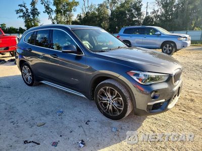 Czwarte zdjęcie samochodu z boku: 2017 BMW X1 XDRIVE28I VIN:WBXHT3Z33H4A55772 - miniatura
