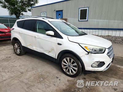 Czwarte zdjęcie samochodu z boku: 2017 FORD ESCAPE TITANIUM VIN:1FMCU9J97HUA35413 - miniatura
