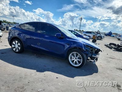 Czwarte zdjęcie samochodu z boku: 2023 TESLA MODEL Y VIN:7SAYGAEE3PF856139 - miniatura