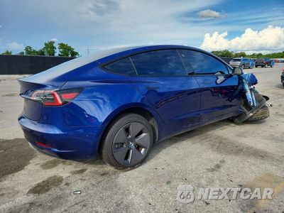 Trzecie zdjęcie samochodu z tyłu: 2023 TESLA MODEL 3 VIN:5YJ3E1EA5PF616598 - miniatura